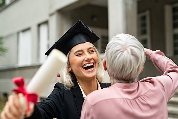 Graduate-student-in-black-gown-wearing-mortar-board